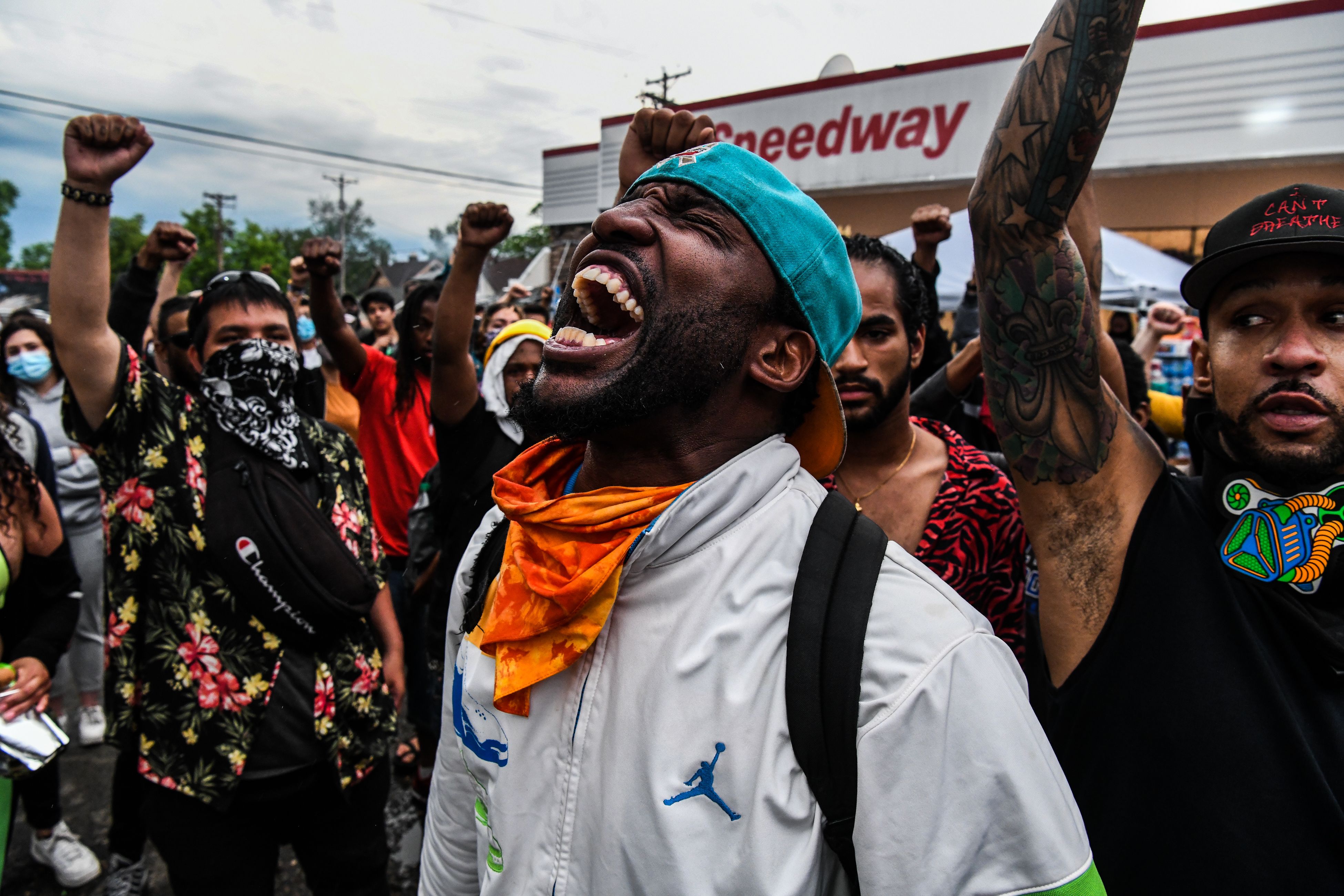 Demonstrators protest at the makeshift memorial in honor of George Floyd, on June 2, 2020 in Minneapolis, Minnesota.  Thousands of National Guard troops patrolled major US cities after protests over racism and police brutality sparked more clashes between police, protestors and looters.