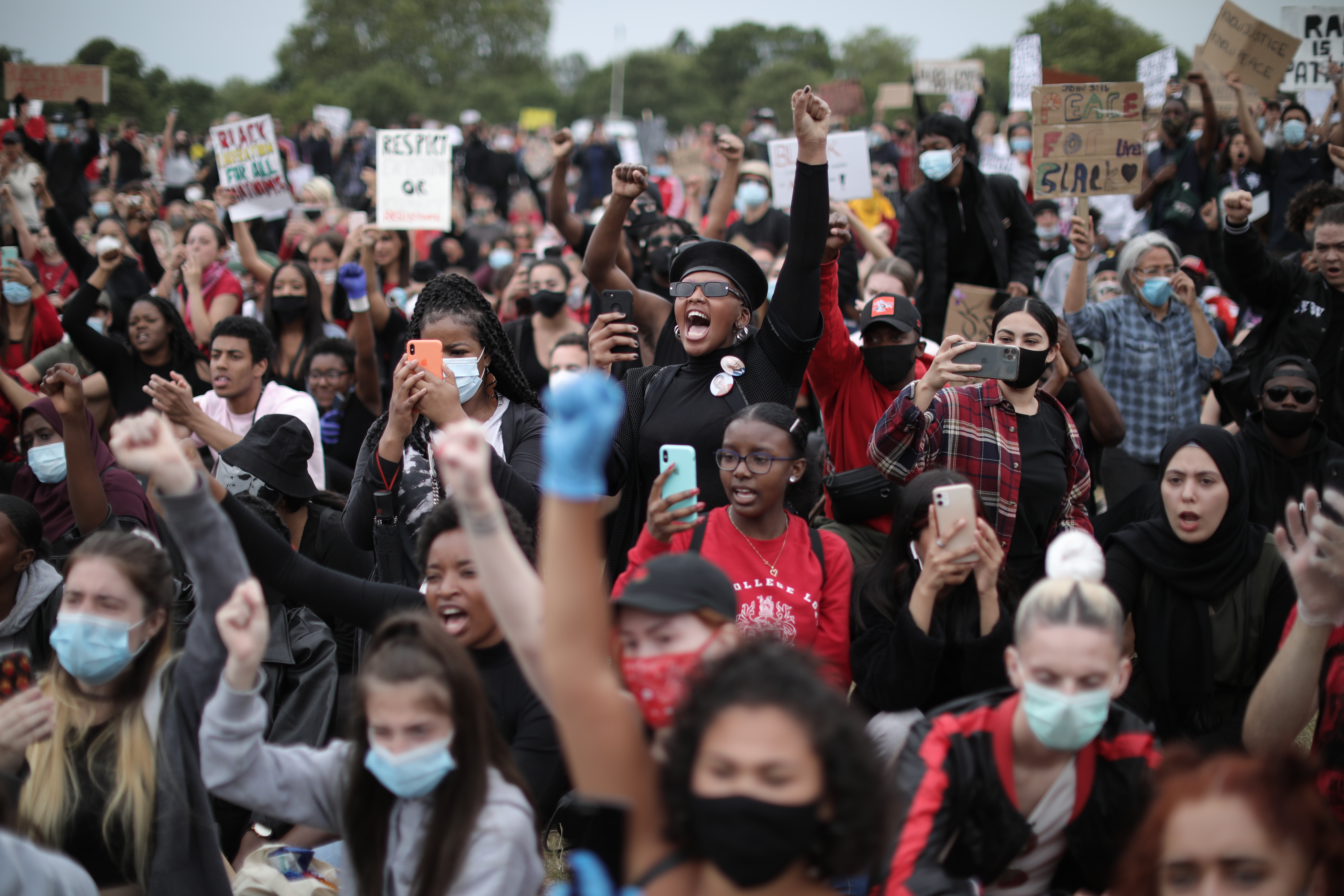 Protesters raise clenched fists during a Black Lives Matter protest in Hyde Park on June 3, 2020, in London, United Kingdom. The death of an African-American man, George Floyd, while in the custody of Minneapolis police has sparked protests across the United States, as well as demonstrations of solidarity in many countries around the world.