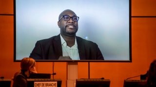 A TV screen displays George Floyd's brother, Philonise Floyd speaking via video message during an urgent debate on "systemic racism" in the United States and beyond at the Human Rights Council on June 17, 2020 in Geneva.