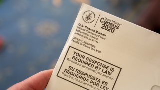 In this April 24, 2020, file photo, someone holds a letter from the Census Bureau regarding the 2020 Census in San Ramon, California.
