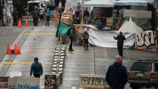 Concrete barriers are situated outside of the Seattle Police Department's vacated East Precinct.