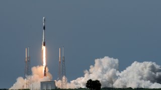 A SpaceX rocket lifts off.