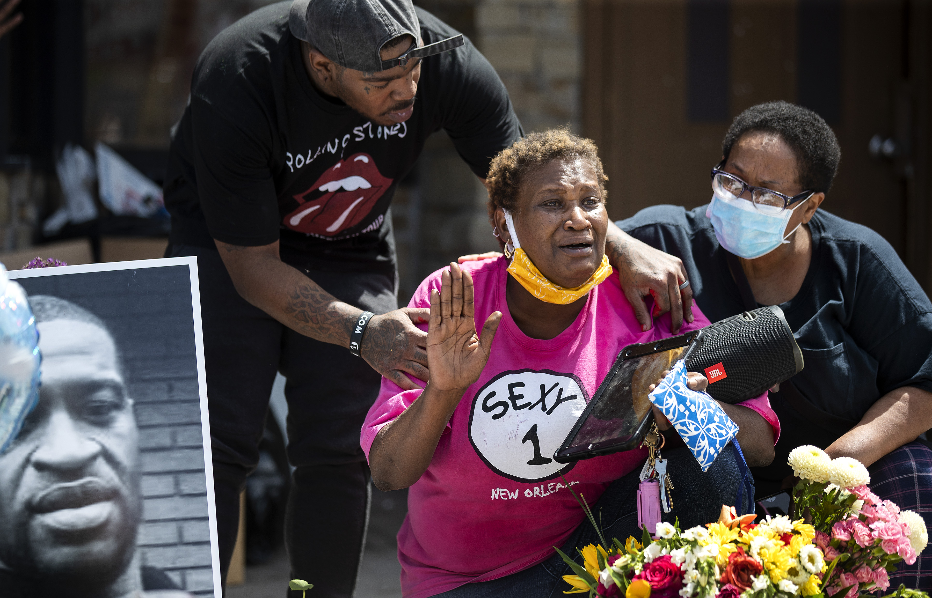 Tony L Clark, left, consoles Gwen Dumas at the site where George Floyd was killed in front of the Cup Food Store. Protesters gathered at 38th and Chicago where George Floyd was killed for the third night of protests on May 28, 2020.