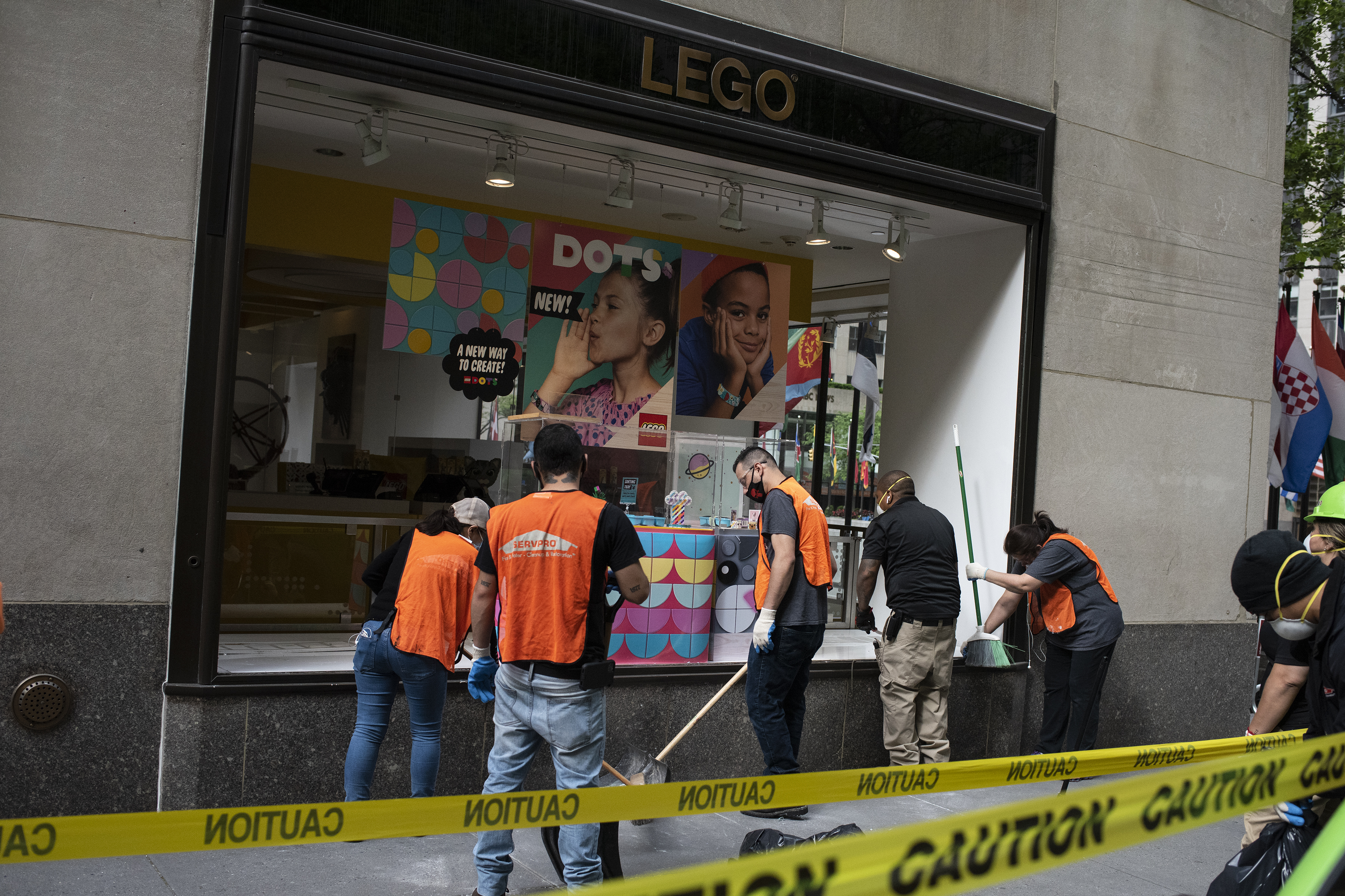 Workers clean up after a protest on June 2, 2020, in New York City’s Rockefeller Center. Protests spread across the country in at least 30 cities across the United States, over the death of unarmed black man George Floyd at the hands of a police officer – the latest death in a series of police involved deaths of a black American.