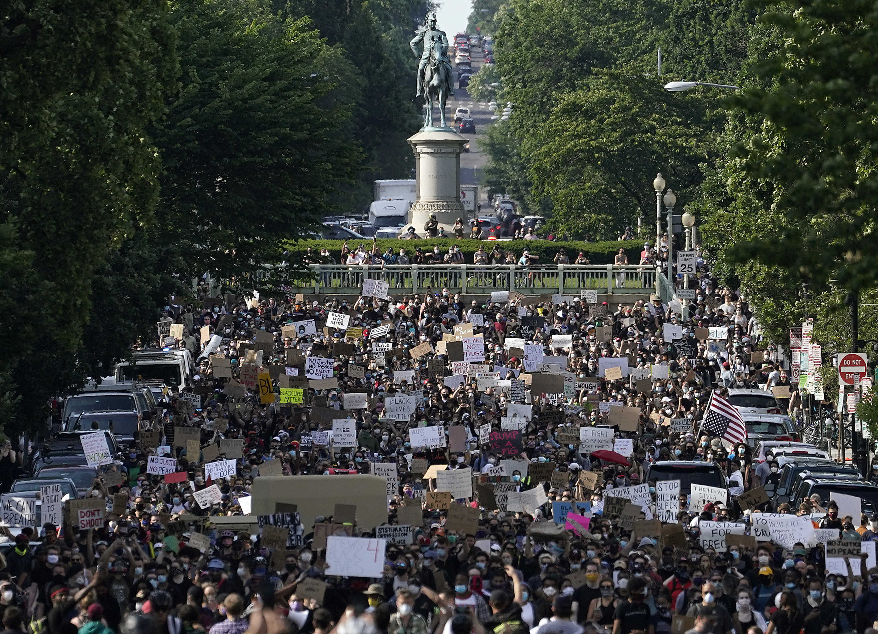 Hundreds of demonstrators march  toward Lafayette Park and the White House to protest against police brutality and the death of George Floyd, on June 2, 2020, in Washington, DC.