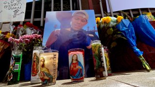 Pictures, candles and notes appear at a memorial for Andres Guardado.