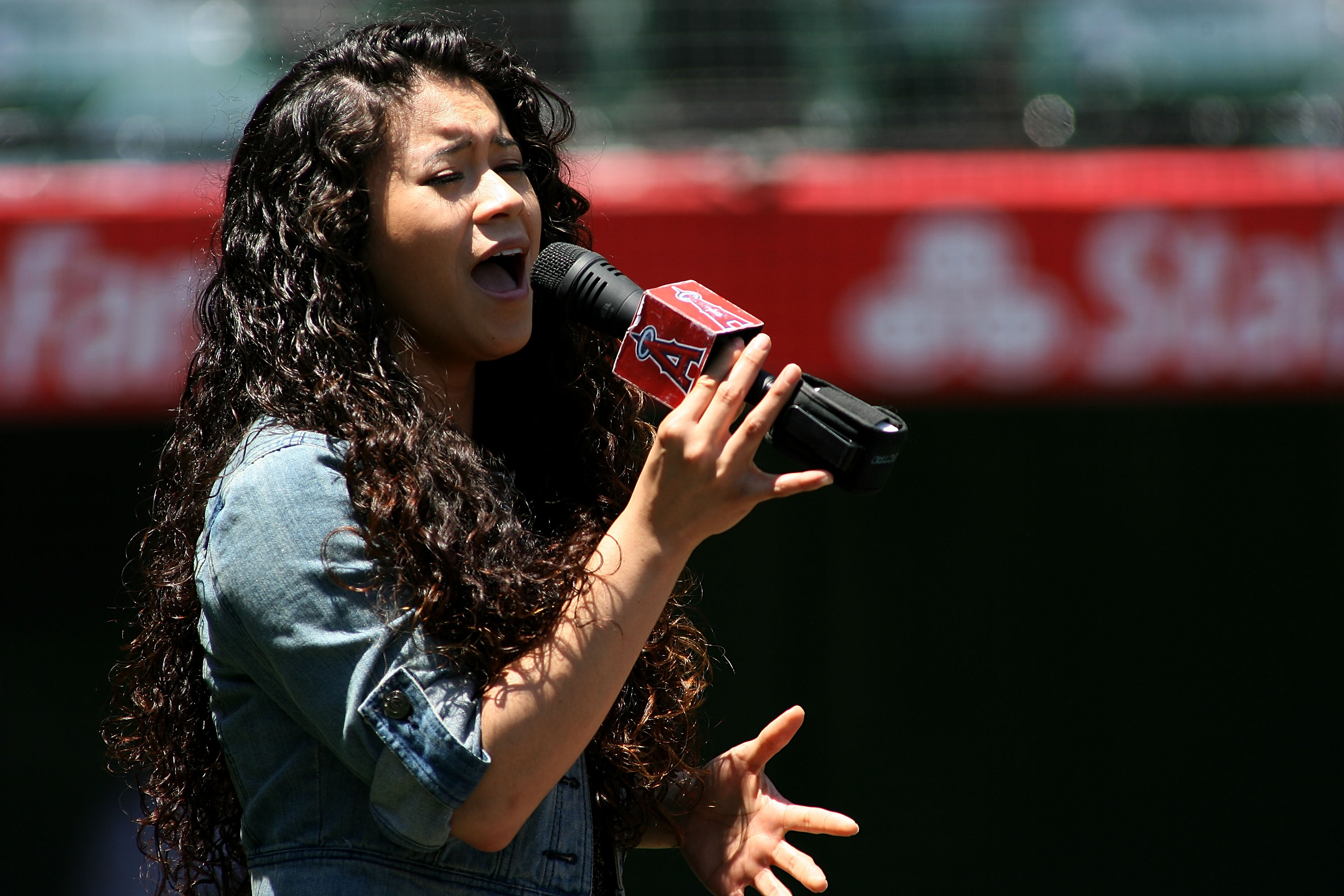 ANAHEIM, CA - JULY 21: Lorelei Sinco performs the National Anthem before the game between the Texas Rangers and the Los Angeles Angels of Anaheim at Angel Stadium of Anaheim on July 21, 2012 in Anaheim, California. (Photo by Jeff Golden/Getty Images)