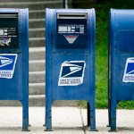 In this May 9, 2013, file photo, U.S. Postal Service (USPS) mailboxes stand in Washington, D.C.