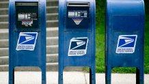 In this May 9, 2013, file photo, U.S. Postal Service (USPS) mailboxes stand in Washington, D.C.