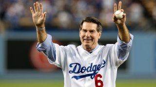 Los Angeles Dodgers legend Steve Garvey throws out a ceremonial first pitch before the Dodgers take on the Atlanta Braves in Game Four of the National League Division Series at Dodger Stadium on October 7, 2013 in Los Angeles, California. (Photo by Stephen Dunn/Getty Images)