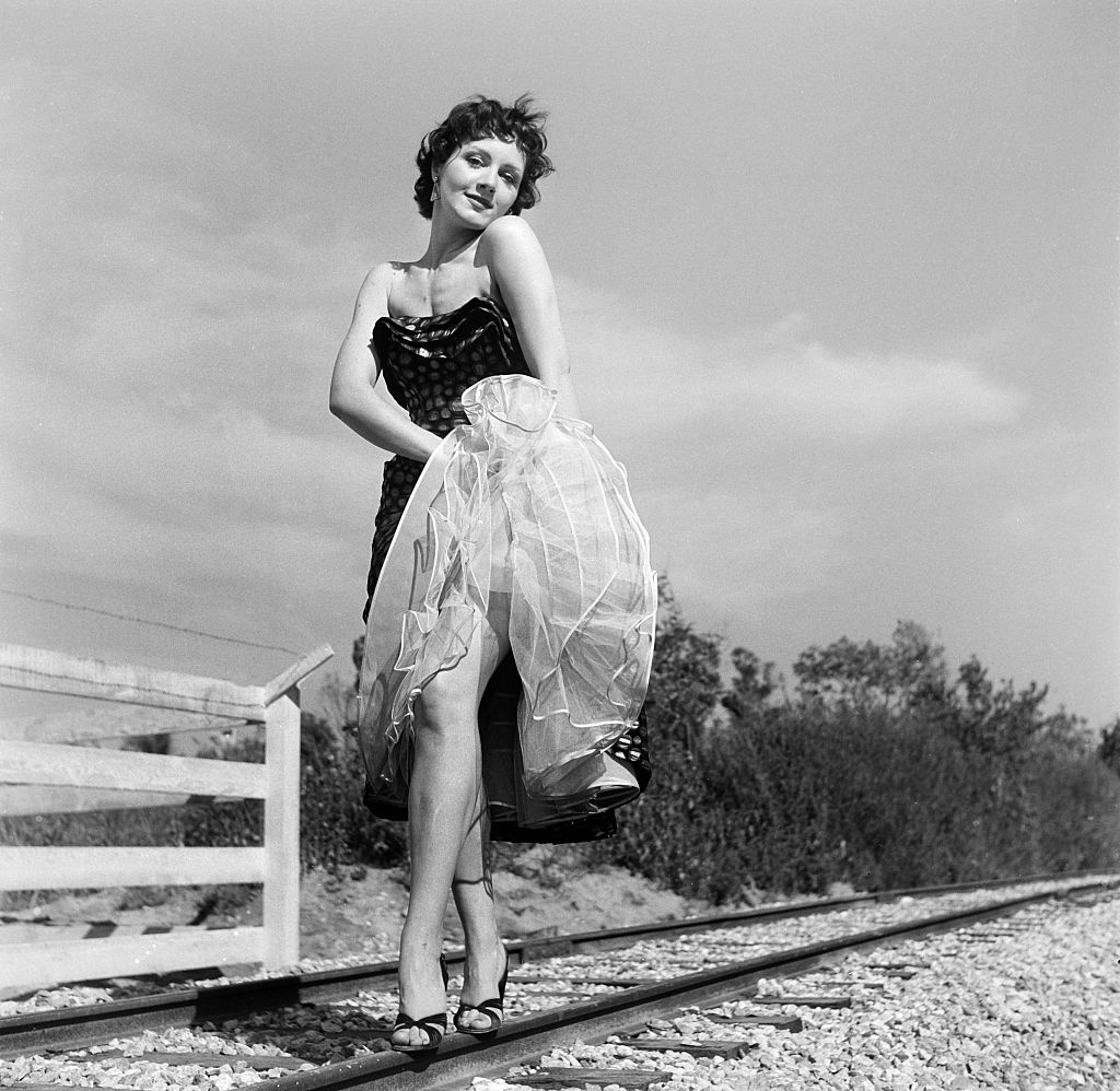 Actress Kathleen Case poses on the train tracks on Autopia during the Openi...