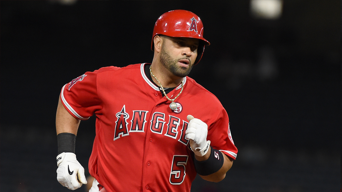 Albert Pujols appears at spring training, promptly gets first fine