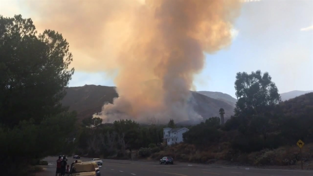 A brush fire that erupted Monday July 31, 2017 on the west end of Lake Elsinore scorched more than 200 acres and prompted evacuations and road closures.