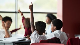 kids raising hands