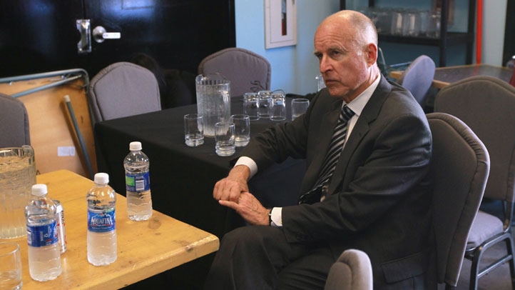 Jerry Brown Sitting at table
