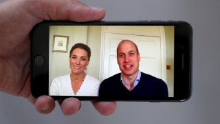 In this May 15, 2020, file photo, Prince William, Duke of Cambridge, and Catherine, Duchess of Cambridge, speak to crisis volunteers on a video-call to mark the first anniversary of Shout85258 in London, England.