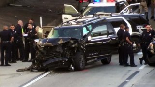 A stolen hearse crashed on the 110 Freeway with a body and casket inside.