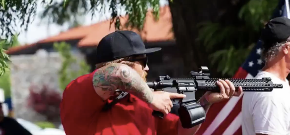 Man Caught on Camera Brandishing Rifle at Protest Charged With Assault ...