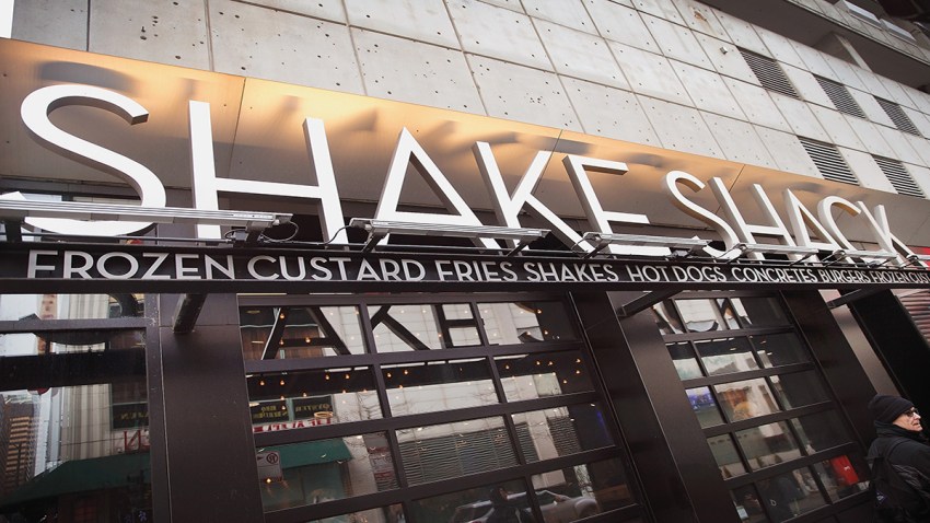 In this Jan. 28, 2015, file photo, a sign hangs outside of a Shake Shack restaurant in Chicago, Illinois.