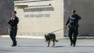 Police officers patrol outside of JCC