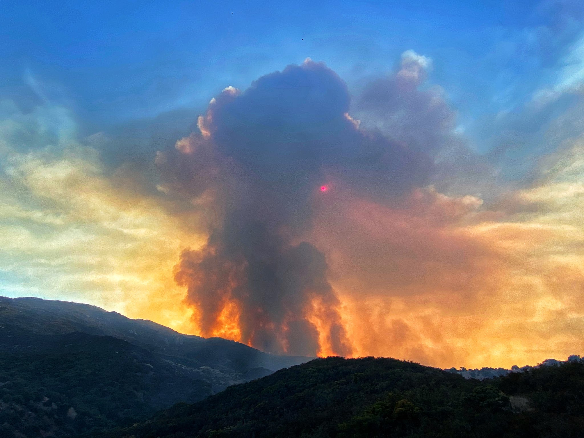 "Fire activity blocks out the sun Tuesday morning as flames move north towards East Camino Cielo in the Los Padres NF."