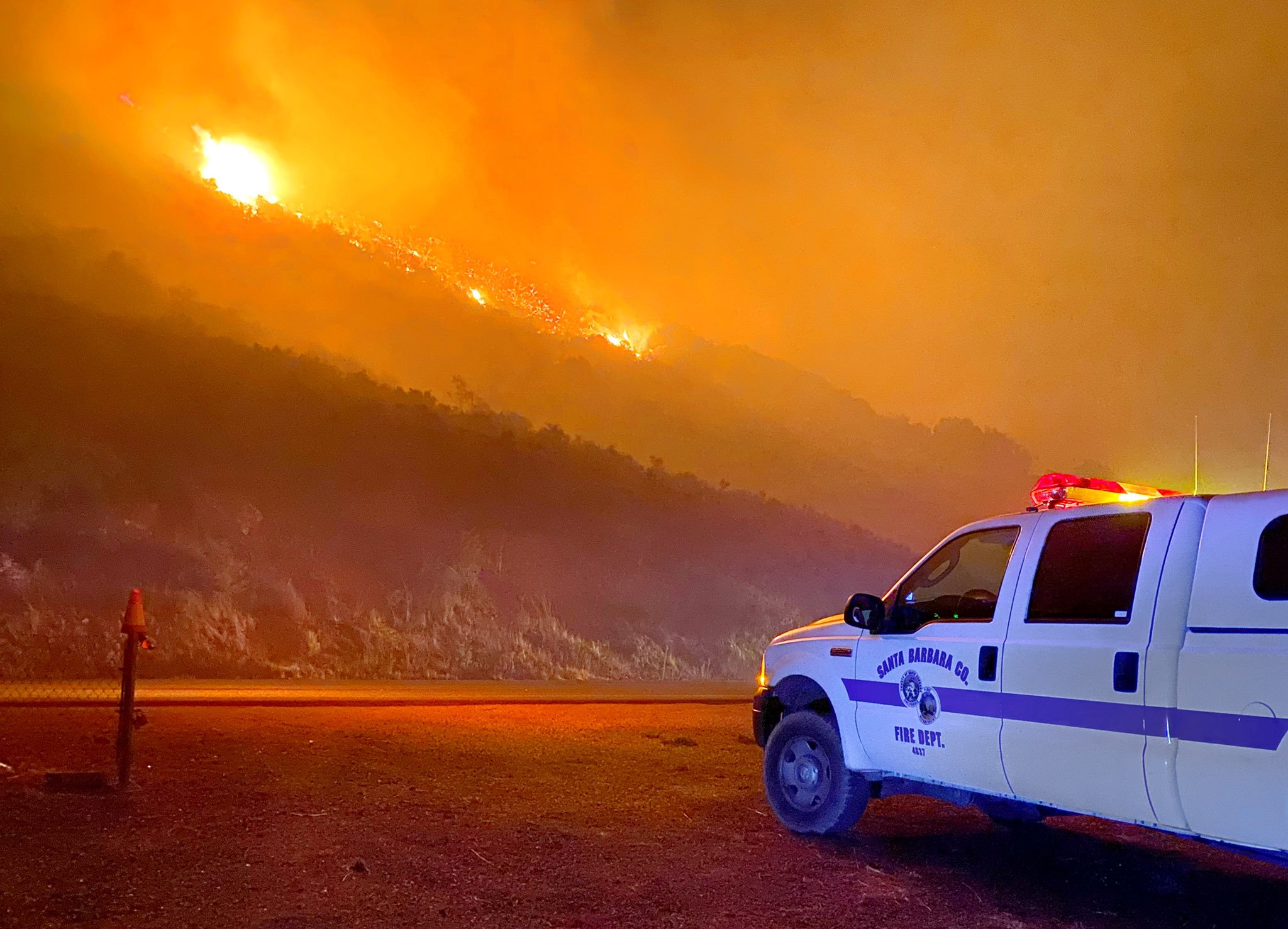 "Flames chew their way towards CA Hwy-154 early Tuesday morning east of Painted Cave Road in Santa Barbara County."