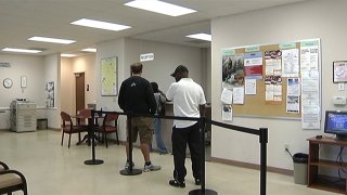 File image of people in line to file at an unemployment center