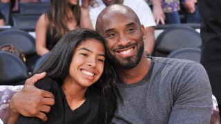 In this file photo, Kobe Bryant and his daughter Gianna Bryant attend a basketball game between the Los Angeles Lakers and the Atlanta Hawks at Staples Center on November 17, 2019 in Los Angeles, California.