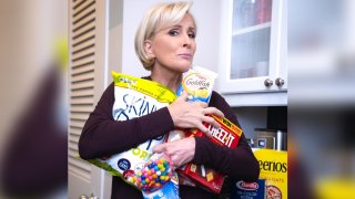 Mika Brzezinski clutching a variety of snacks.