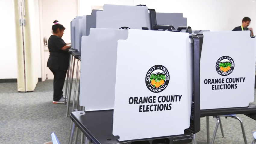 A woman votes in Orange County