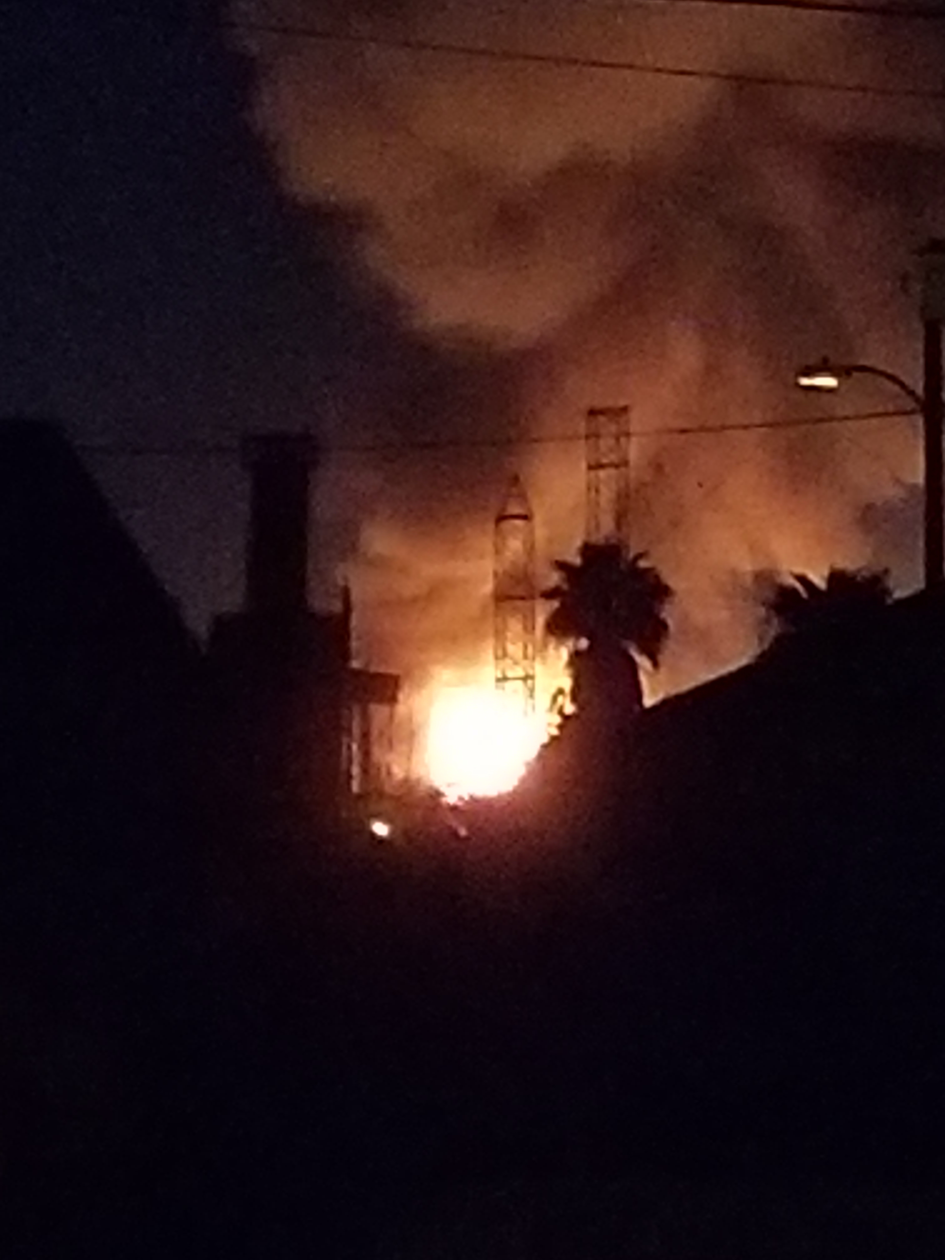A fire burns at a Carson oil refinery.