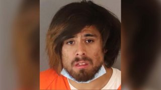 A mugshot shows a man arrested in a Riverside camera shop theft.