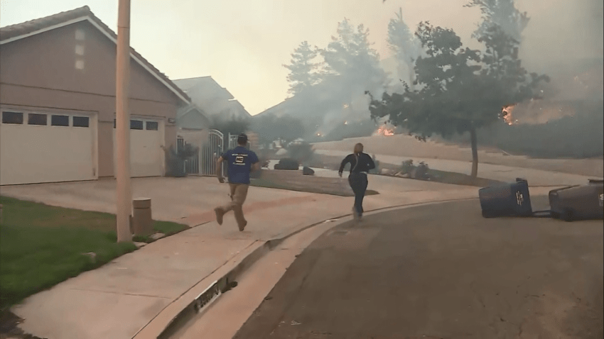 tick fire people running