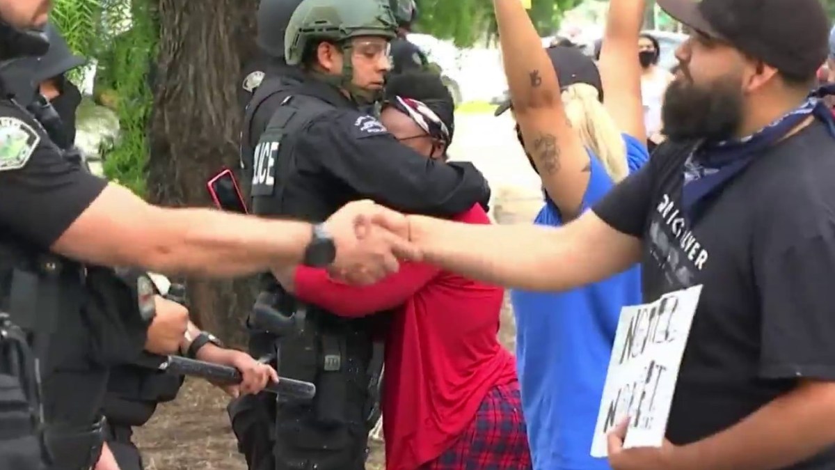 Protester Hugs Officers As They Stand Watch Over Upland Demonstration Nbc Los Angeles 0550