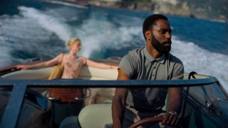 This image released by Warner Bros. Entertainment shows Elizabeth Debicki, left, and John David Washington in a scene from "Tenet."