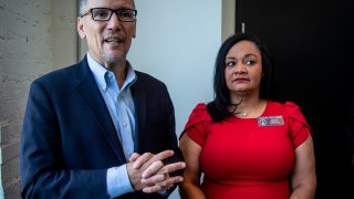 FILE-In this Wednesday, Nov. 20, 2019 file photo, Tom Perez, left, chair of the Democratic National Committee, and Nikema Williams, chair of the Georgia Democratic Party, speak with reporters, in Atlanta. Georgia Democrats have selected state Sen. Nikema Williams, chair of the state party, to replace Rep. John Lewis on the ballot in November.