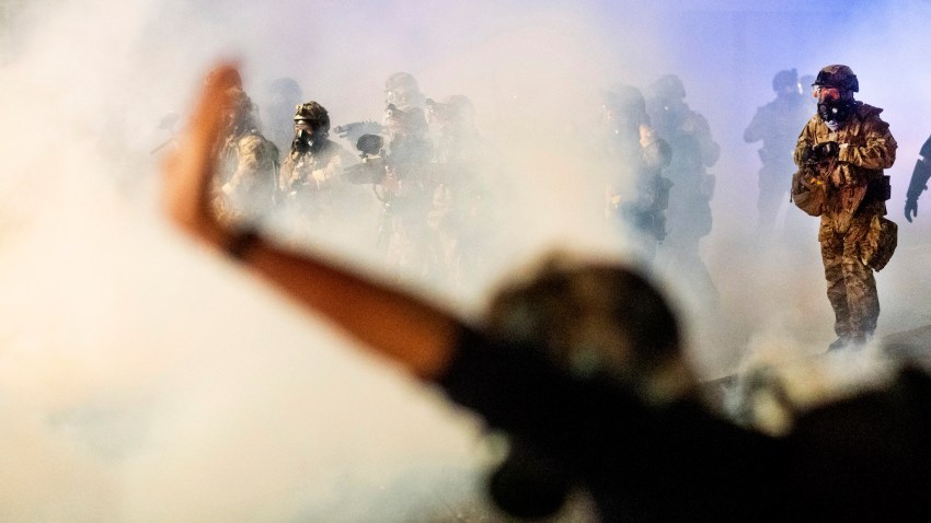 Federal officers use chemical irritants and projectiles to disperse Black Lives Matter protesters at the Mark O. Hatfield United States Courthouse on Friday, July 24, 2020, in Portland, Ore. Since federal officers arrived in downtown Portland in early July, violent protests have largely been limited to a two block radius from the courthouse.