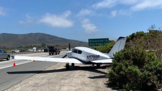 In a photo provided by the California Highway Patrol, a small plane is on the shoulder after making an emergency landing on Interstate 5, between San Clemente and San Onofre, Calif., Monday, July 27, 2020. The pilot of the small plane that lost engine power made a safe emergency landing on the Southern California highway, authorities said. After rejecting the Pacific Coast Highway as a possible landing spot because it was too narrow, the pilot opted to set the plane down on Interstate 5, the Orange County Register reported.