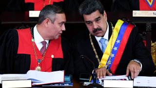 Venezuelan President Nicolas Maduro (R) listens to the president of the Supreme Court of Justice Maikel Moreno (L), during the opening ceremony of the judicial year at the Supreme Court of Justice in Caracas, on Jan. 31, 2020.