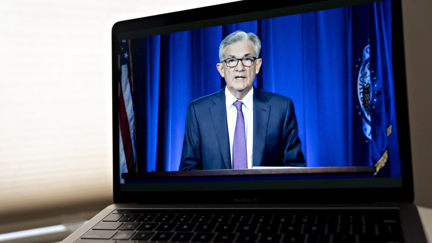 Jerome Powell, chairman of the U.S. Federal Reserve, speaks during a virtual news conference seen on a laptop computer in Arlington, Virginia, U.S., on Wednesday, July 29, 2020. Federal Reserve officials left their benchmark interest rate unchanged near zero and again vowed to use all their tools to support the U.S. economy amid a shaky recovery from the coronavirus pandemic.
