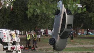 An Audi is pulled from a lake.