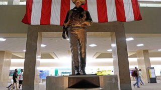 John Wayne memorial statue in the Thomas F. Riley Terminal at John Wayne Airport – Orange County on Wednesday, July 22, 2020 in Santa Ana, CA. The statue was dedicated on Nov. 4, 1984.