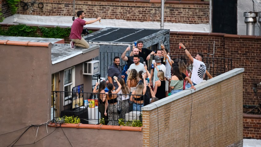 People party on a rooftop in Kips Bay, New York.