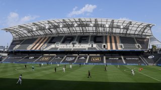 In a stadium without fans, Keeper Kenneth Vermeer #1 of Los Angeles FC makes a pass during the second half in the opening game against the Los Angeles Galaxy at Banc of California Stadium on August 22, 2020 in Los Angeles, California. The Galaxy won 2-0.