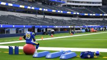 A Rams player in an empty stadium.