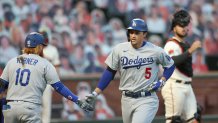 Corey Seager #5 is congratulated by Justin Turner #10 of the Los Angeles Dodgers after he hit a home run in the third inning against the San Francisco Giants at Oracle Park on August 25, 2020 in San Francisco, California. (Photo by Ezra Shaw/Getty Images)