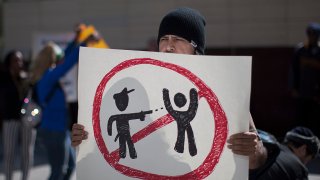 File Image: Protesters at Los Angeles Police Department Headquarters rally to express their anger over the fatal police shooting of an unarmed homeless man on March 3, 2015 in Los Angeles, California. Police say the homeless man, known by acquaintances as Africa, was shot dead by officers when he allegedly reached for the gun of one of several officers wrestling to the ground by his sidewalk tent. Amateur video of the controversial incident has been widely viewed over the internet