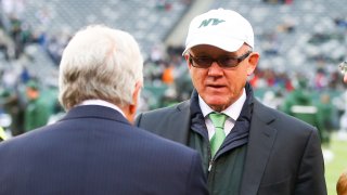 New York Jets Owner Woody Johnson talks with New England Patriots Owner Robert Kraft