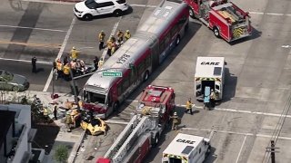 A bus and car collided in East LA.