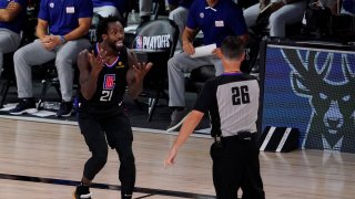 Los Angeles Clippers' Patrick Beverley (21) reacts to a call by referee Pat Fraher (26) during the second half of an NBA conference semifinal playoff basketball game against the Denver Nuggets Saturday, Sept. 5, 2020, in Lake Buena Vista, Fla.
